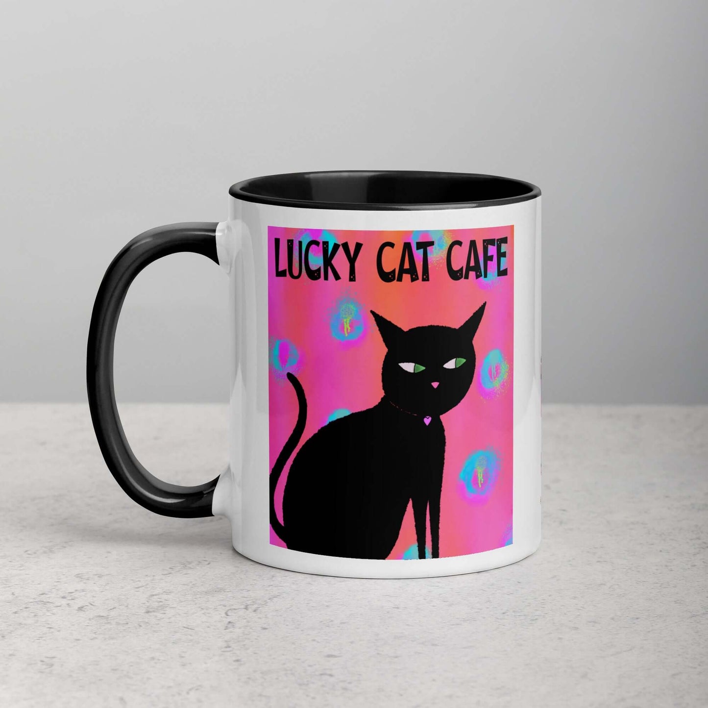 Black Cat on Hot Pink Tie Dye Background with Text “Lucky Cat Cafe” Mug with Black Color Inside Left Handed Front View