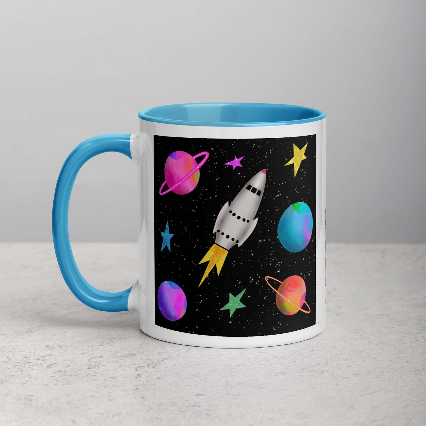 Whimsical Space Rocket with Colorful Planets and Stars on Black Background “Space Rockets” Mug with Light Blue Color Inside Left Handed Front View