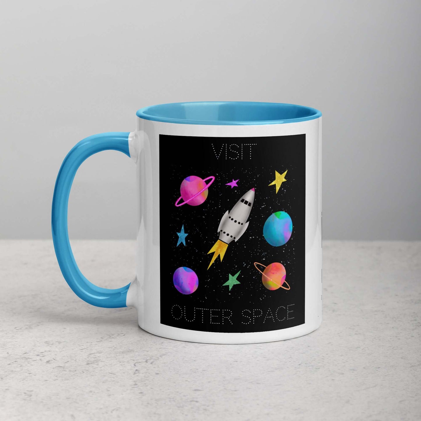 Whimsical Space Rocket with Colorful Planets and Stars on Black Background with Text “Visit Outer Space” Mug with Light Blue Color Inside Left Handed Front View