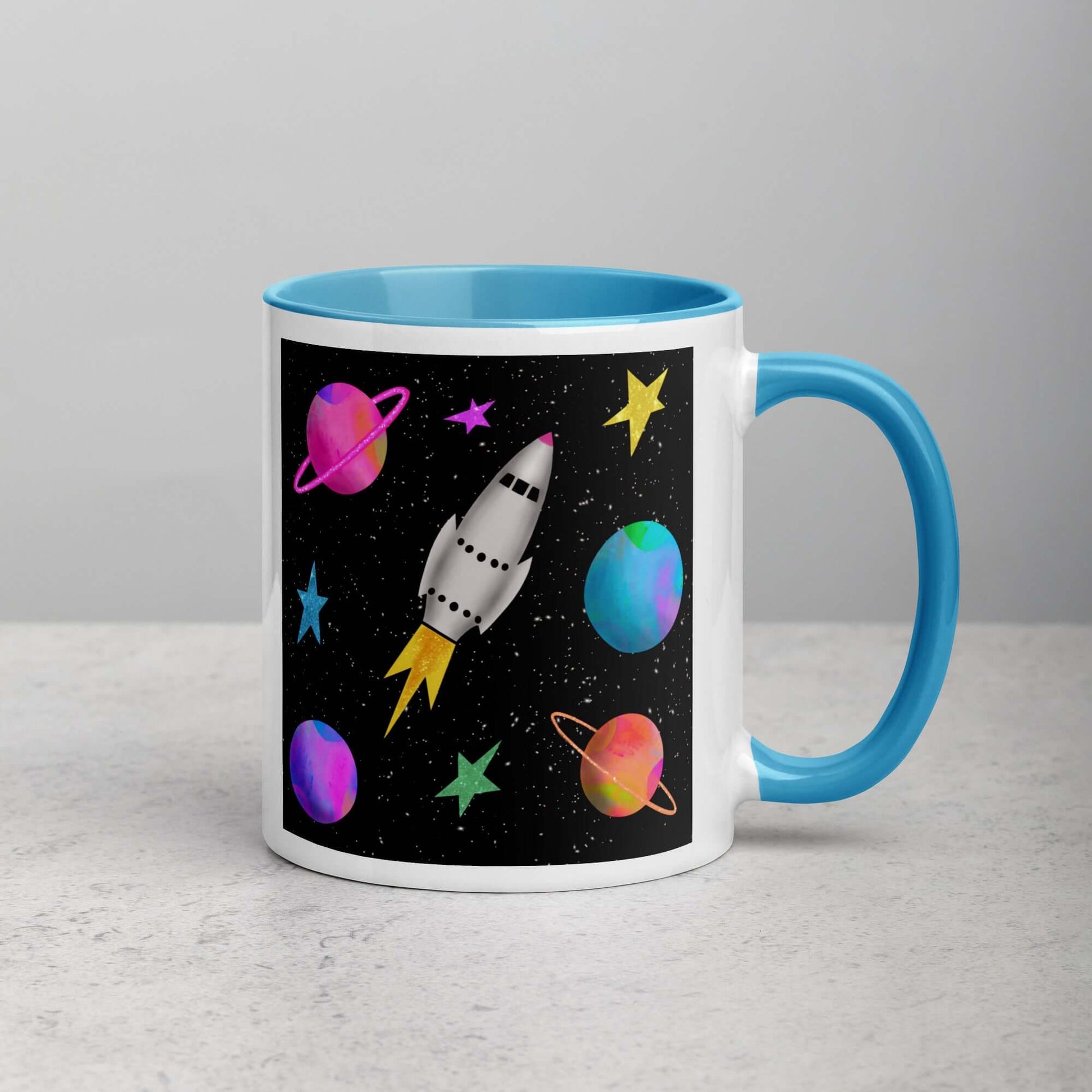 Whimsical Space Rocket with Colorful Planets and Stars on Black Background “Space Rockets” Mug with Light Blue Color Inside Right Handed Front View