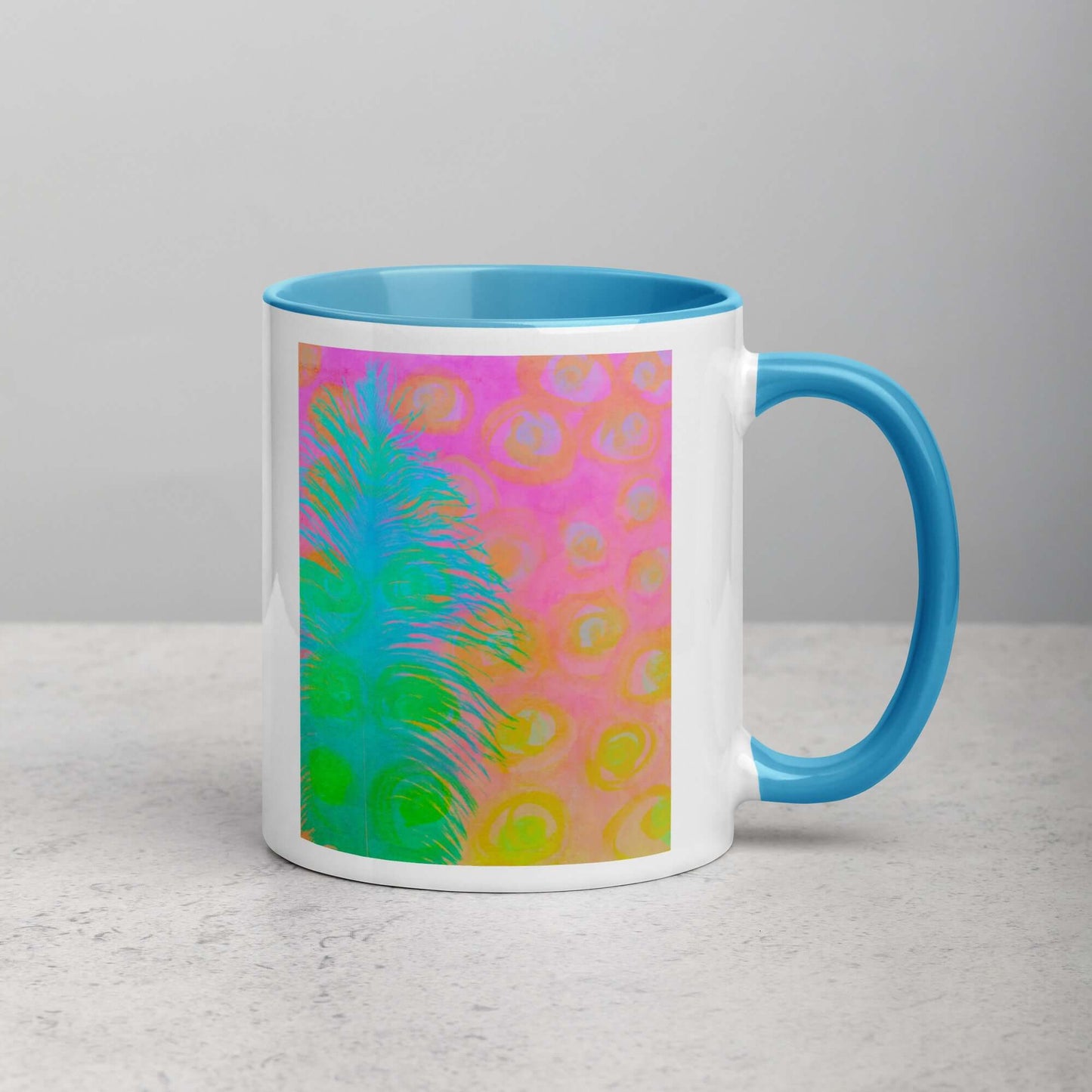 Bright Blue-Green Ostrich Feather on Pink and Yellow Background “My Other Half” Abstract Art Mug with Light Blue Color Inside Right. Handed Front View