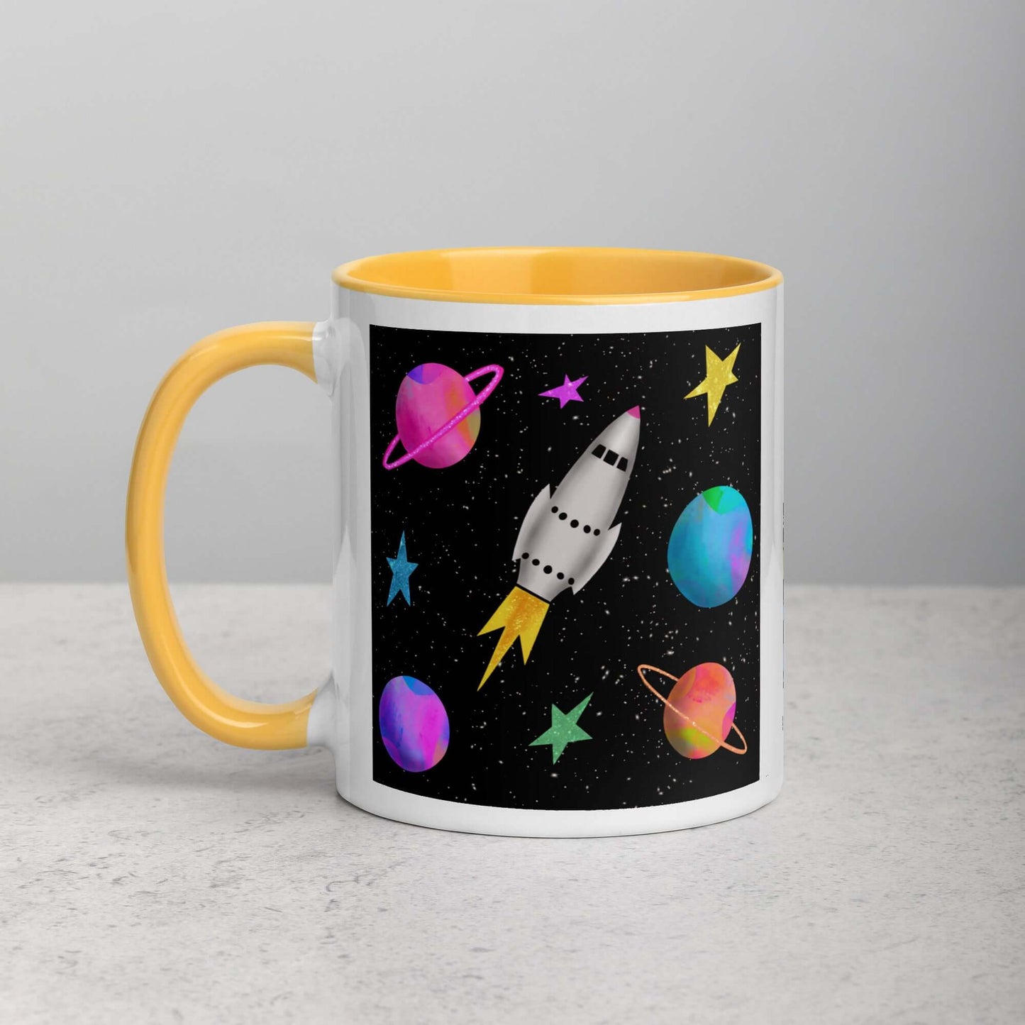 Whimsical Space Rocket with Colorful Planets and Stars on Black Background “Space Rockets” Mug with Golden Yellow Color Inside Left Handed Front View