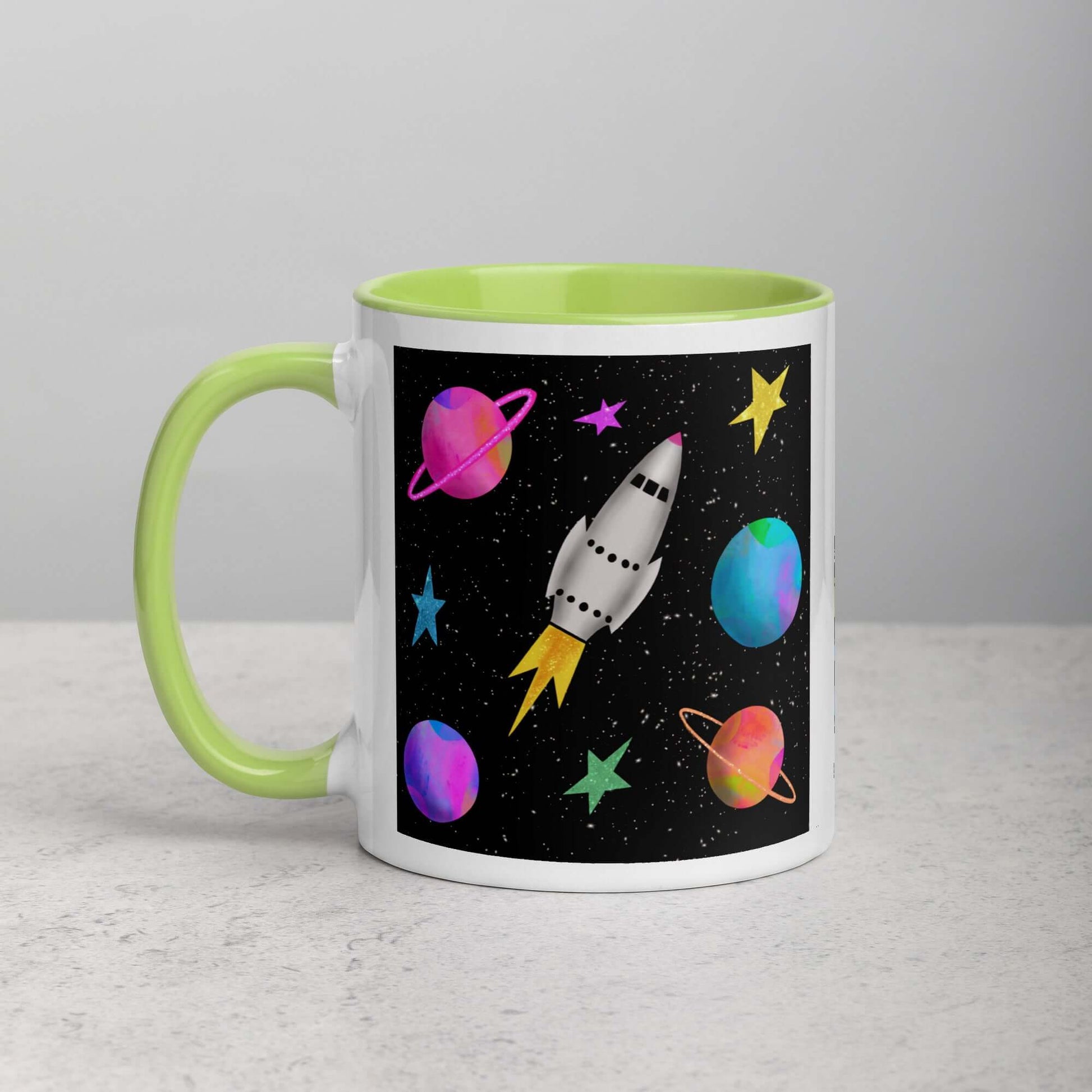 Whimsical Space Rocket with Colorful Planets and Stars on Black Background “Space Rockets” Mug with Lime Green Color Inside Left Handed Front View