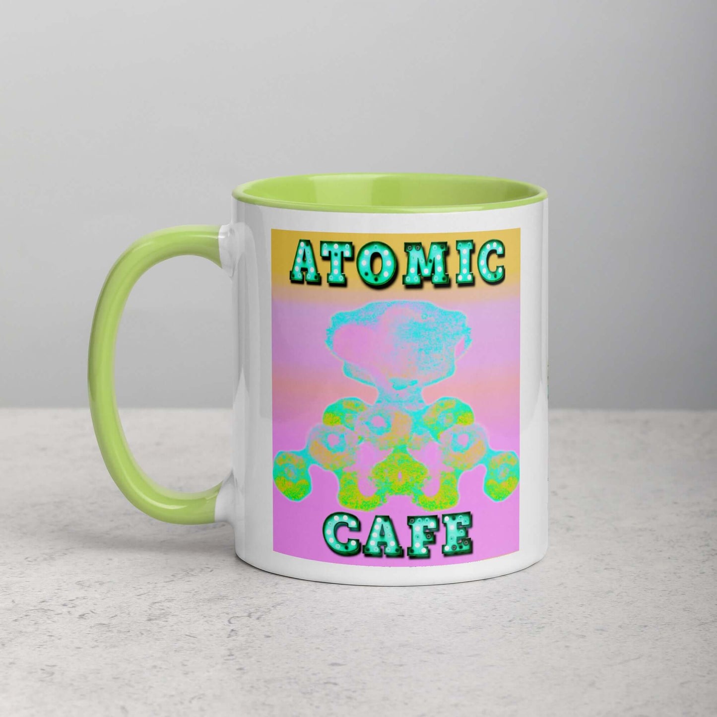 Pastel Atomic Blast with “Atomic Cafe” in Marquee Letters Mug with Lime Green Color Inside Left Handed Front View 