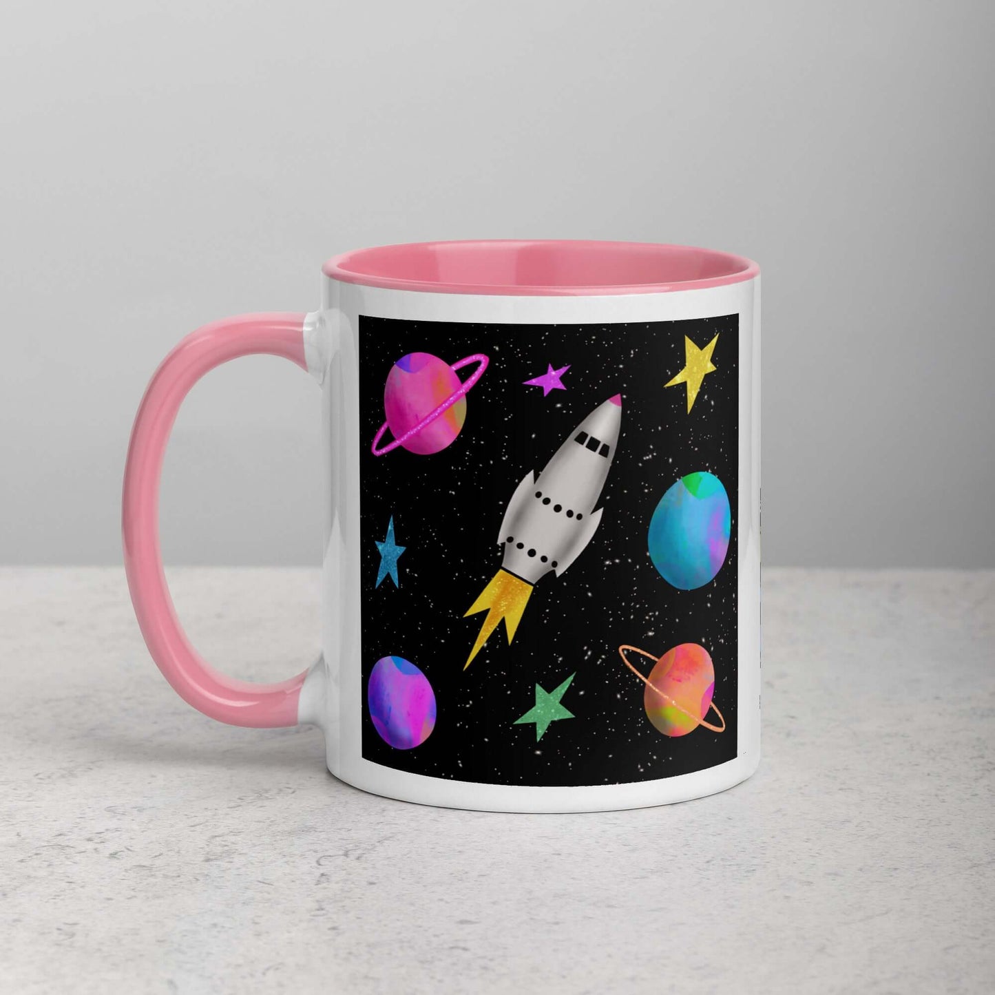Whimsical Space Rocket with Colorful Planets and Stars on Black Background “Space Rockets” Mug with Light Pink Color Inside Left Handed Front View