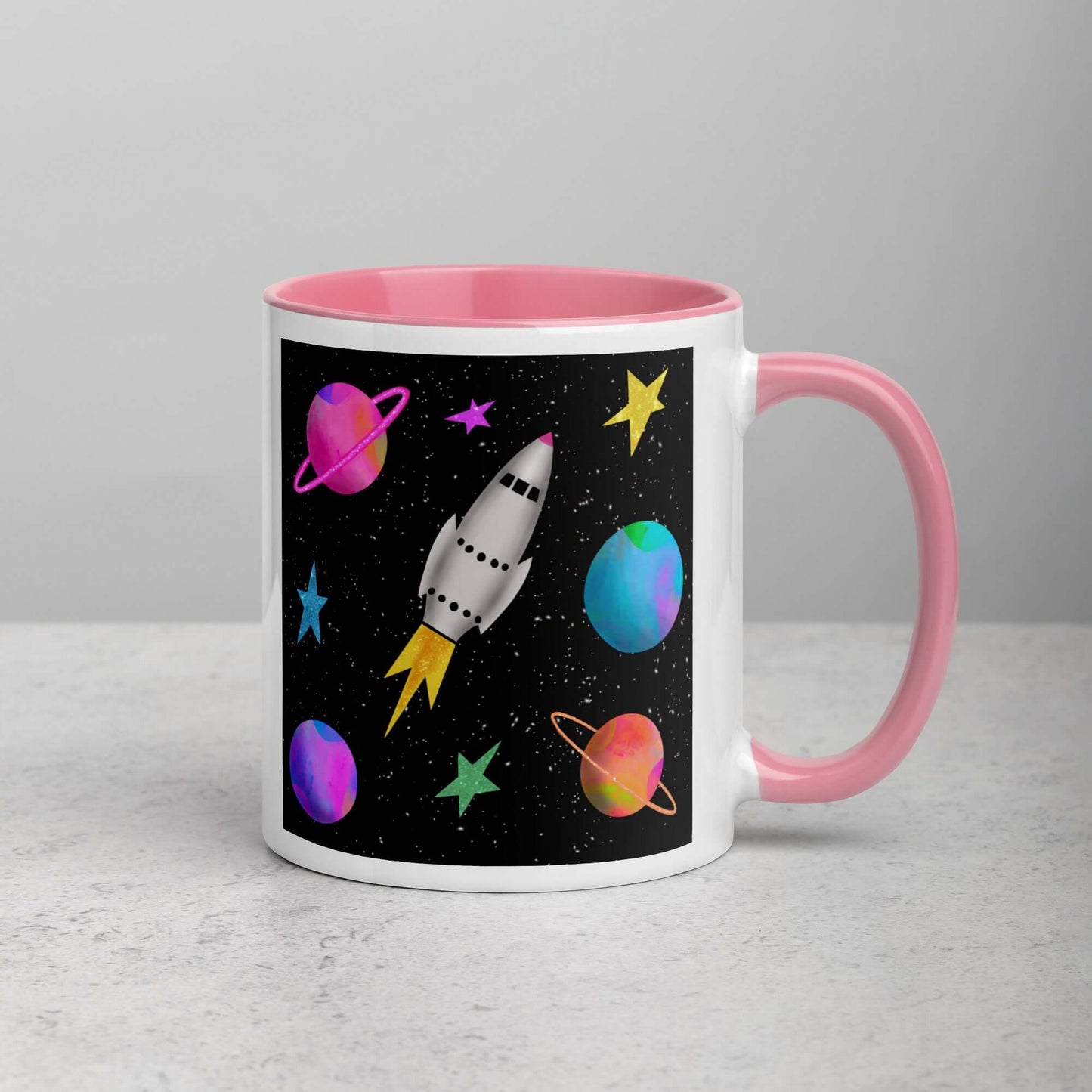 Whimsical Space Rocket with Colorful Planets and Stars on Black Background “Space Rockets” Mug with Light Pink Color Inside Right Handed Front View