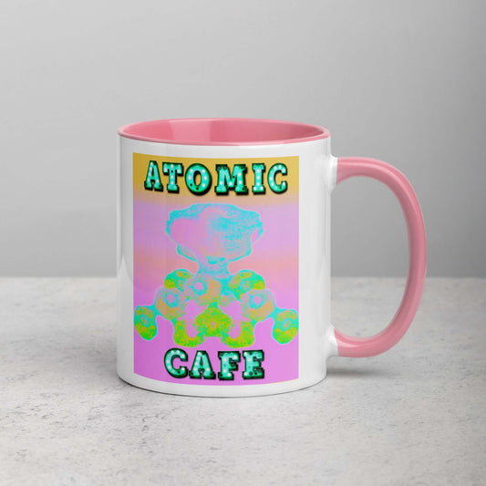 Pastel Atomic Blast with “Atomic Cafe” in Marquee Letters Mug with Light Pink Color Inside Right Handed Front View