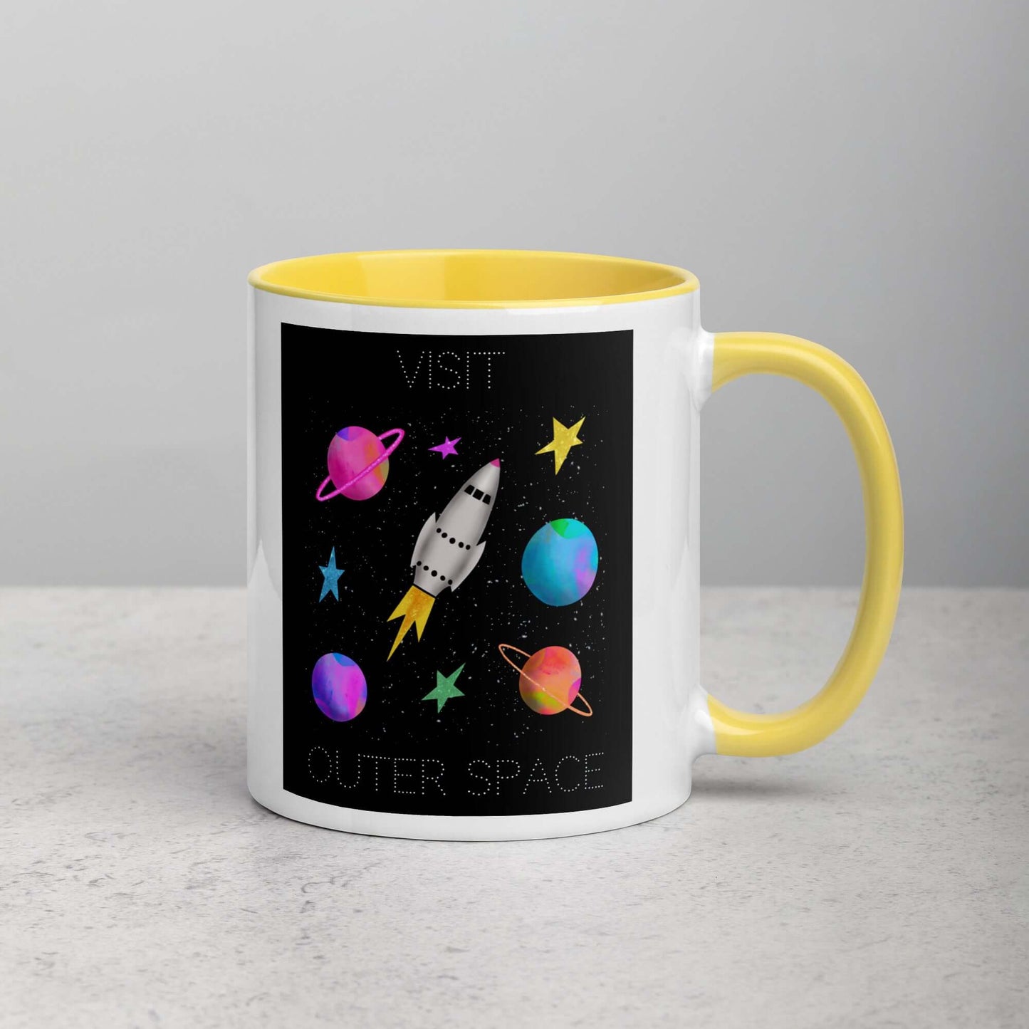 Whimsical Space Rocket with Colorful Planets and Stars on Black Background with Text “Visit Outer Space” Mug with Bright Yellow Color Inside Right Handed Front View